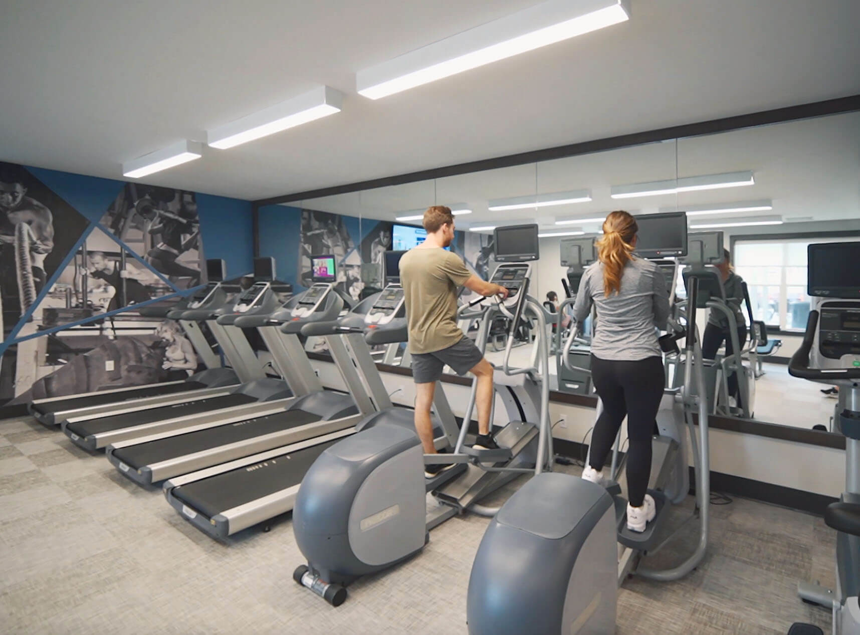 People working out in One William fitness center