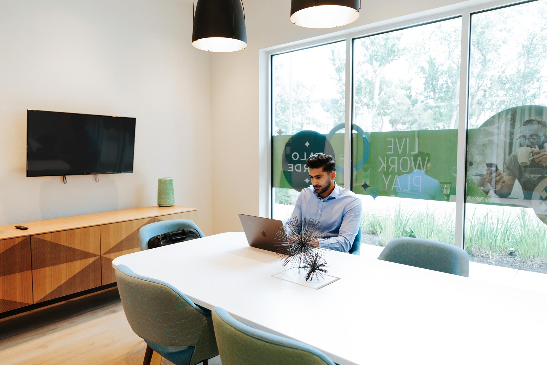Palo Verde man works on laptop in conference room