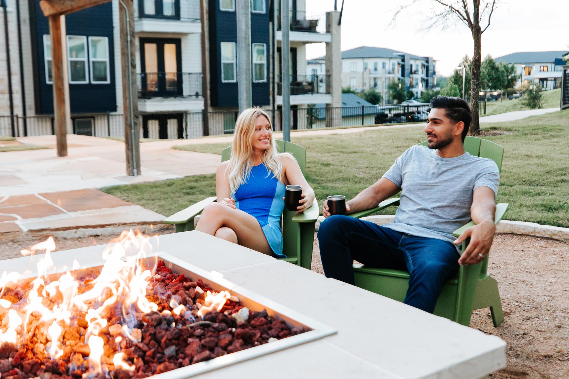 Palo Verde man and woman sit by fire pit