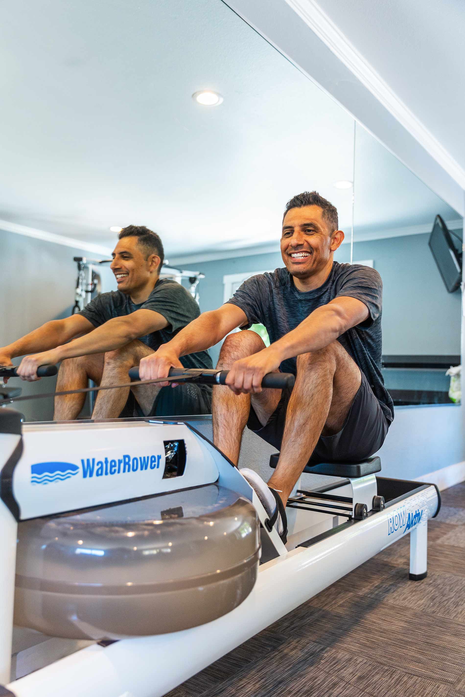 Pointe at Northridge man does rowing machine in gym