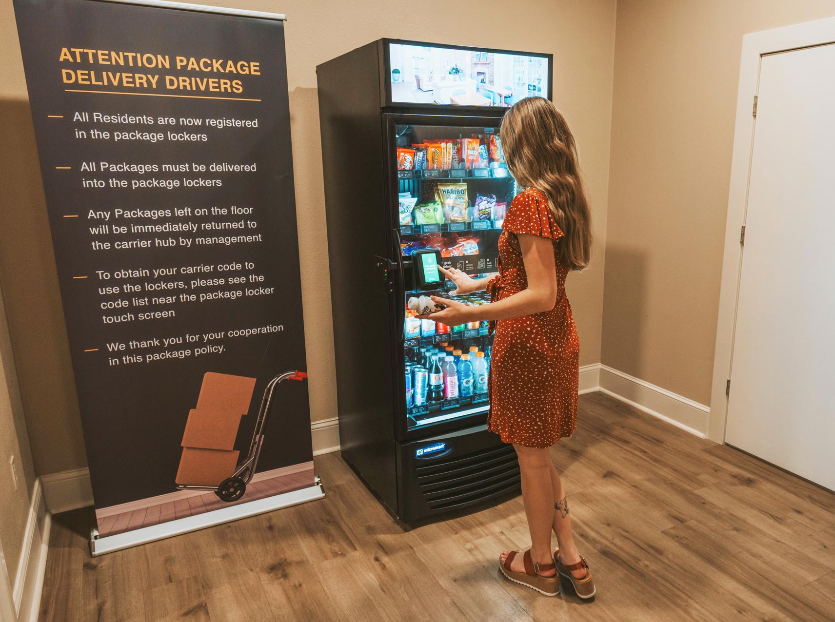 Ridge at Blue Hills woman uses vending machine
