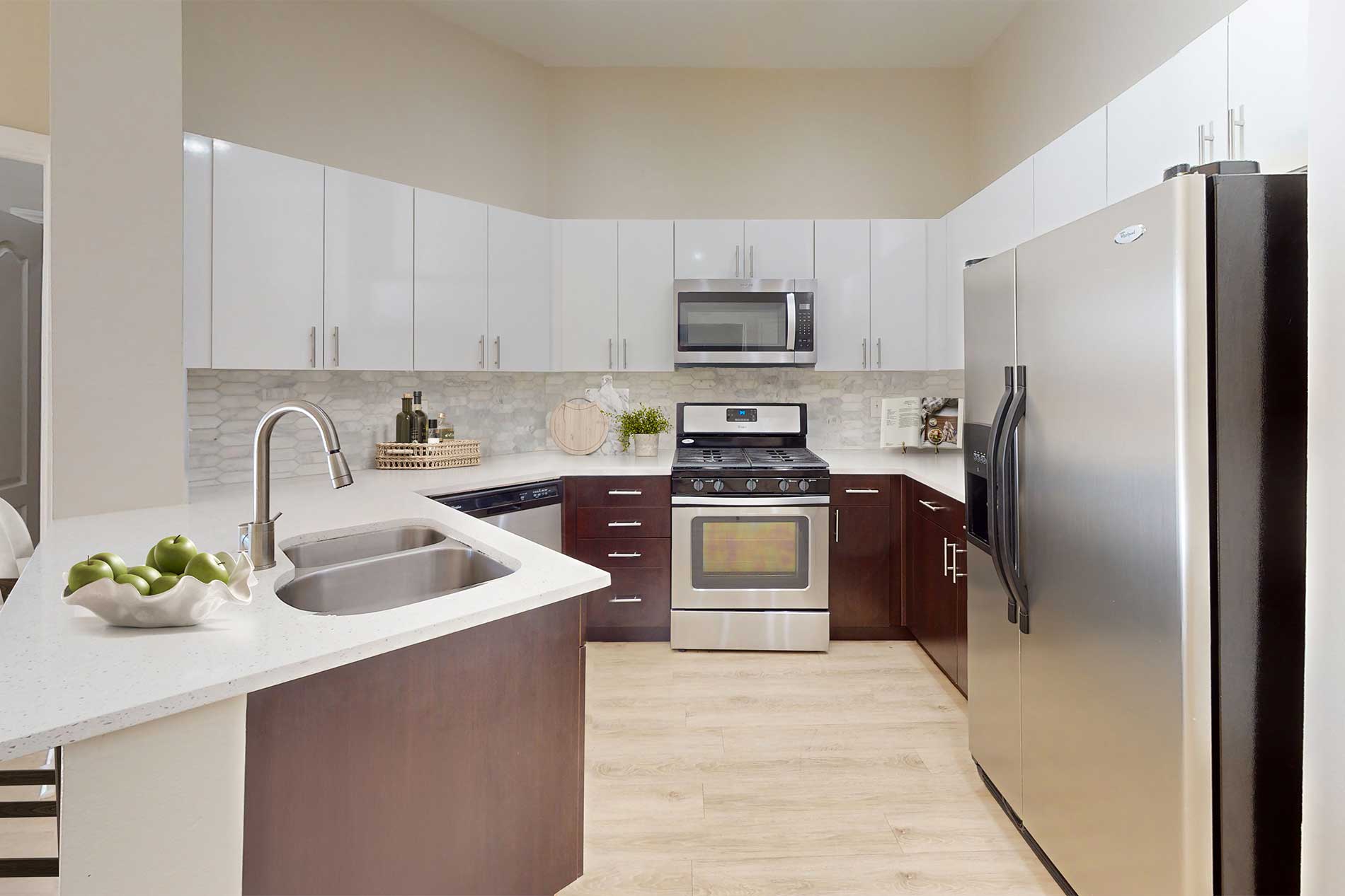 Contemporary kitchen and living space at River Terrace apartments in Santa Clara.