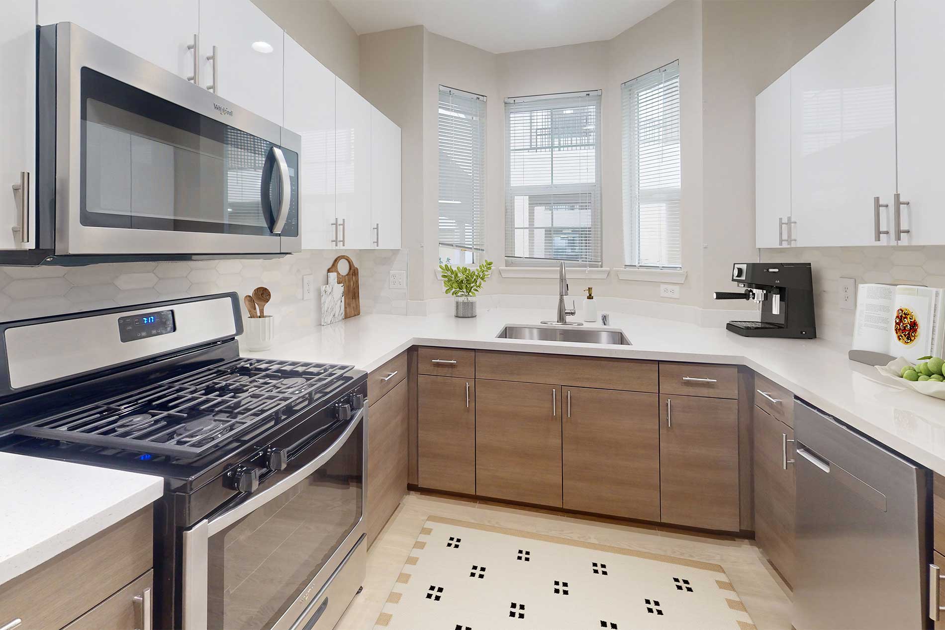 Contemporary kitchen and living space at River Terrace apartments in Santa Clara.