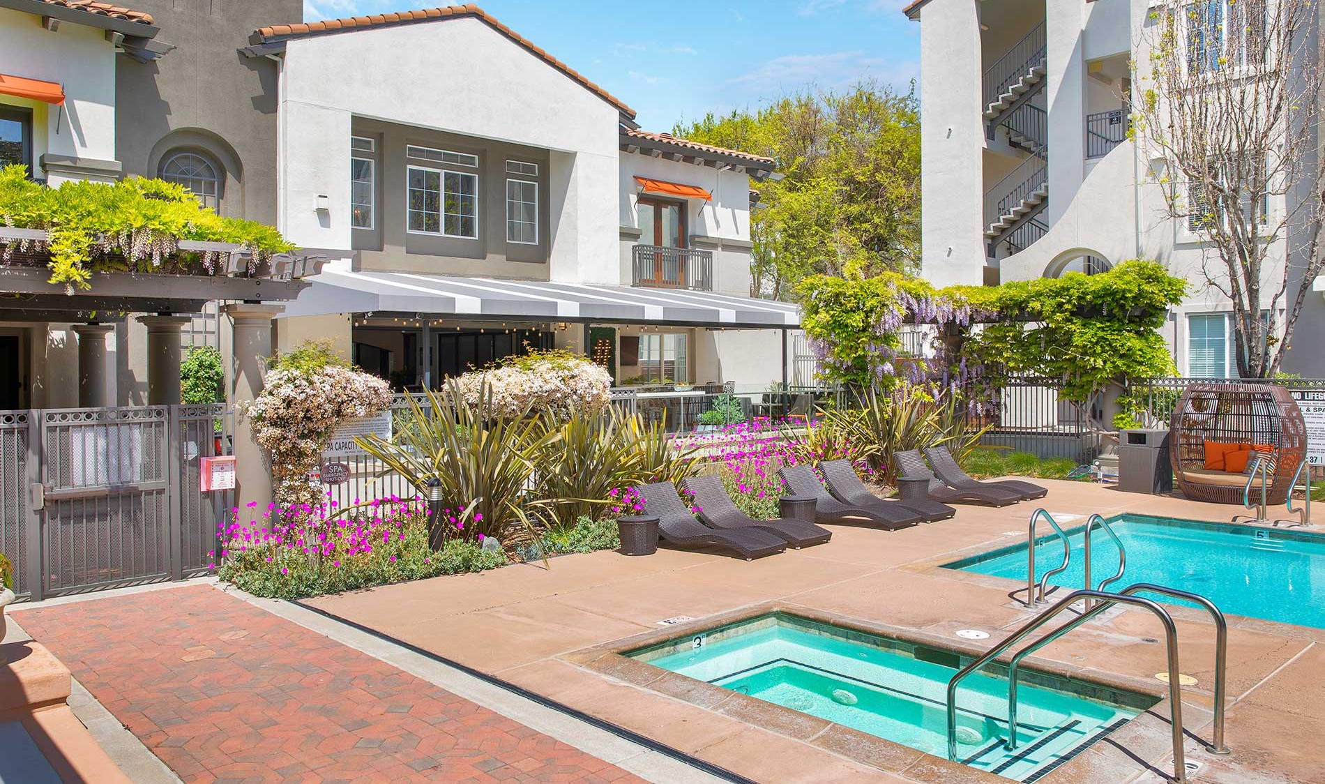 Outdoor swimming pool with lounge seating at River Terrace in Santa Clara.