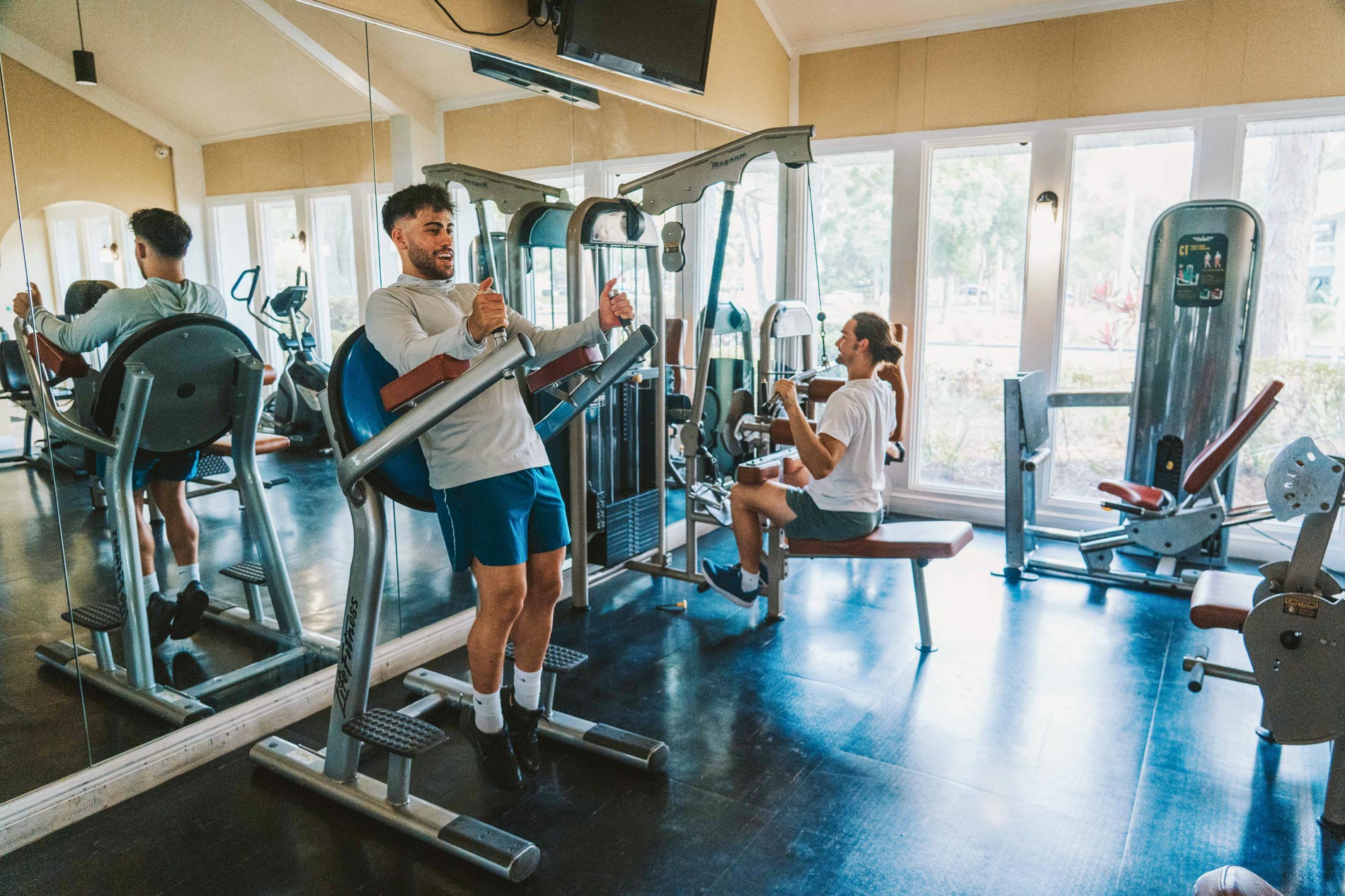 The Breyley two men work out in fitness center