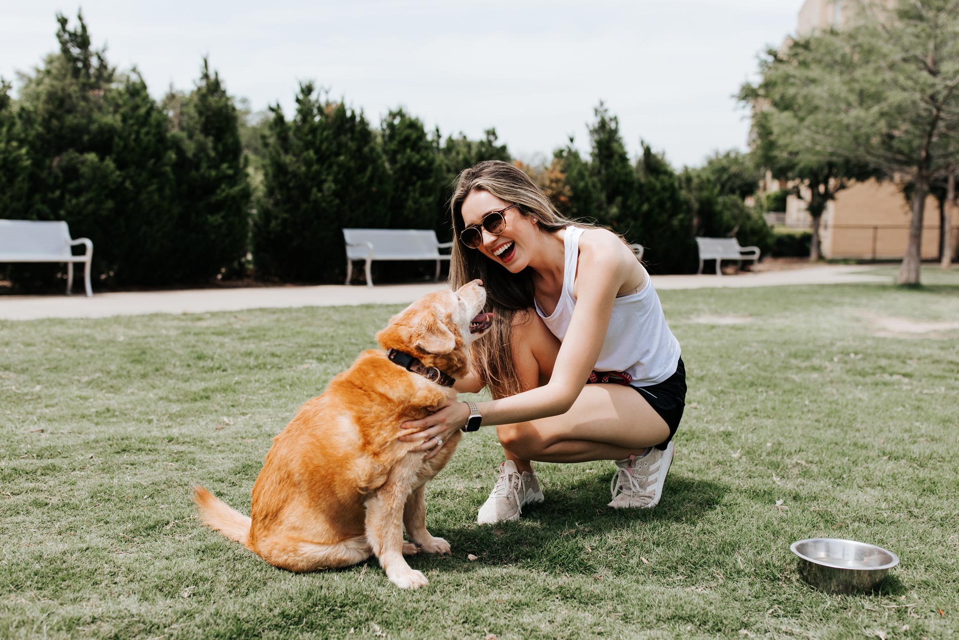 Flats At Palisades woman plays with dog in dog park