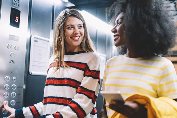 2 women in an elevator