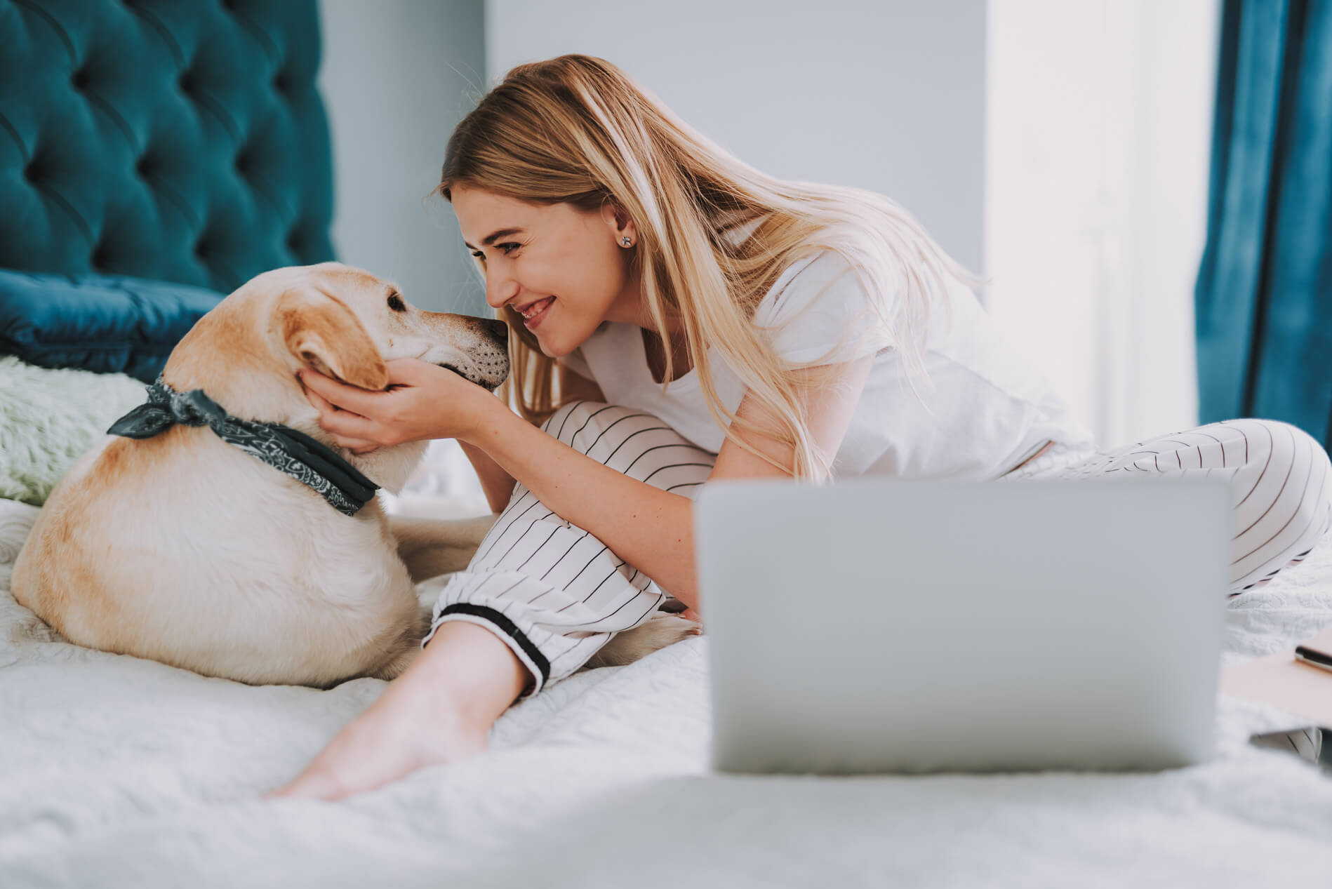 Girl on bed with dog