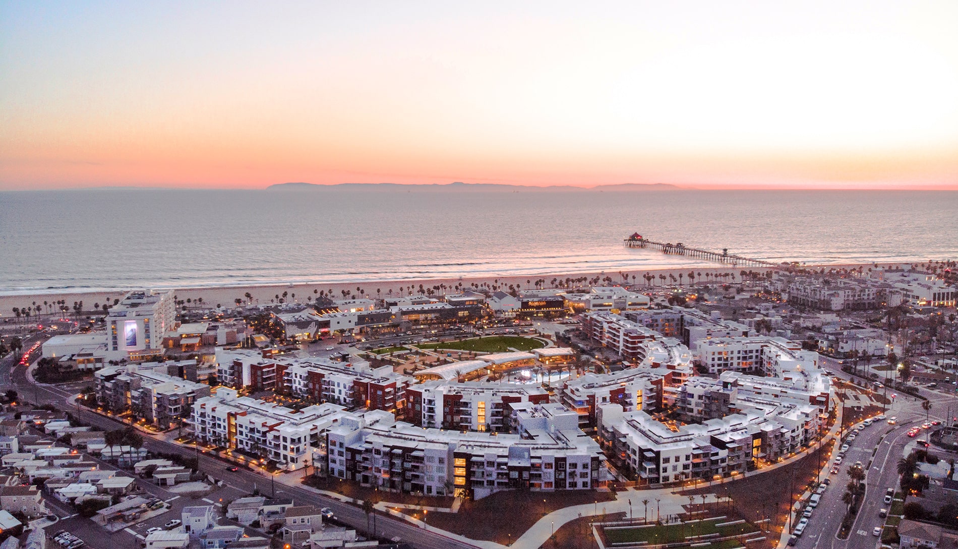 The Residences at Pacific City Apartments Aerial Image of Property, Beach, and Huntington Pier