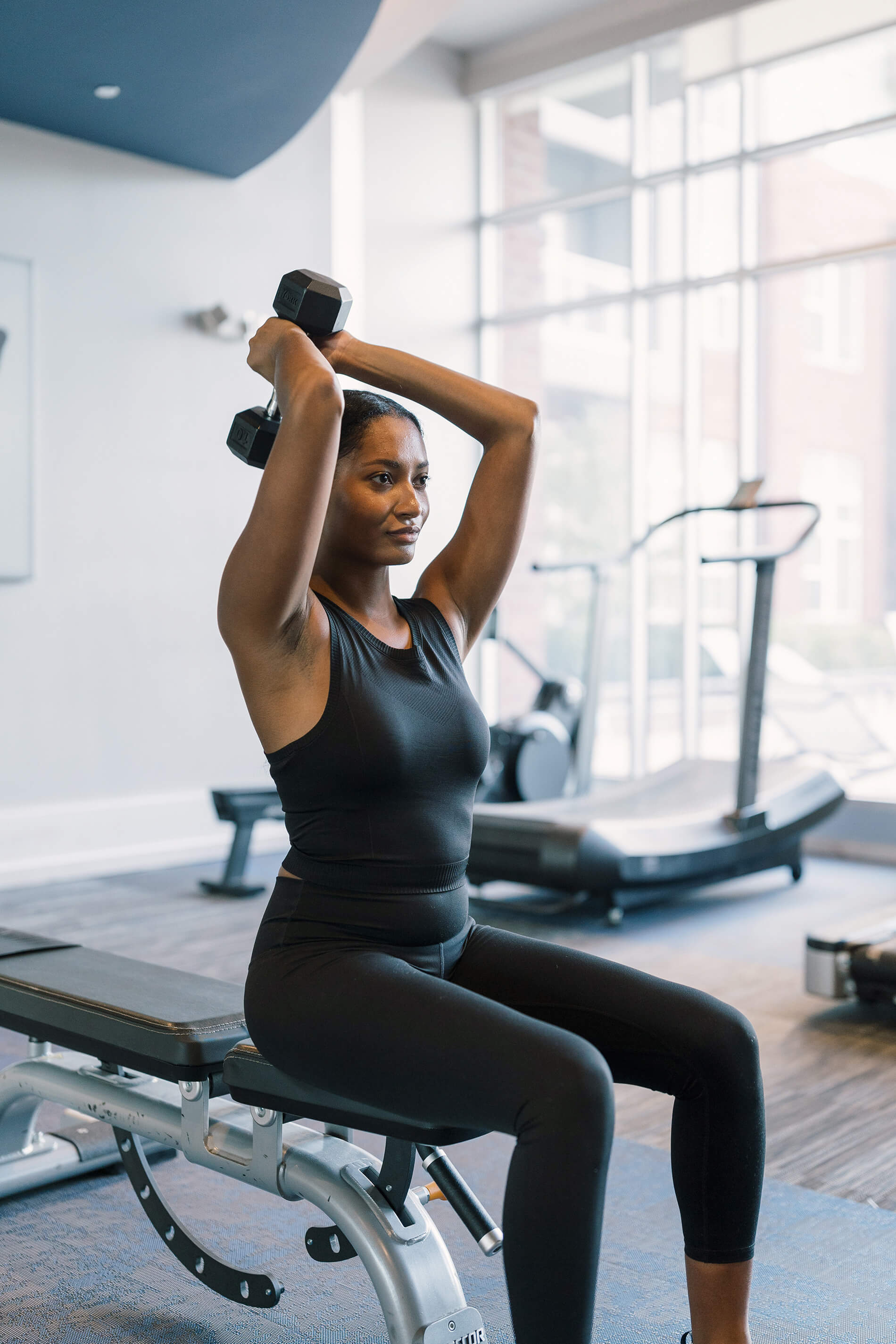 The Smith woman lifts in fitness center