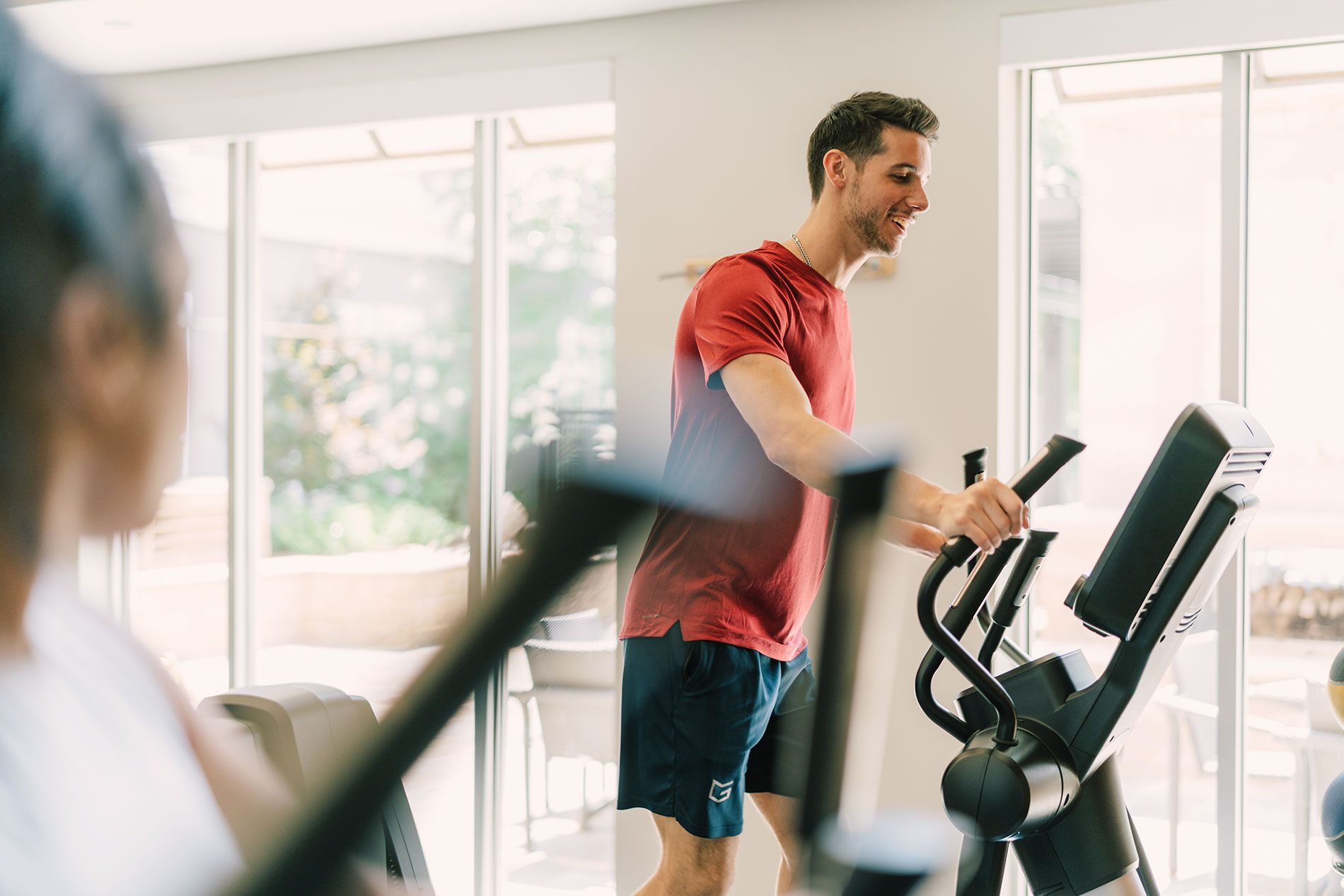 Towson Promenade man and women on elliptical machines