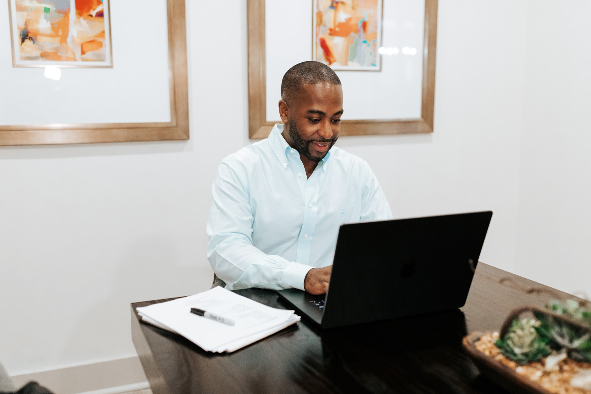 Villaggio man works in conference room