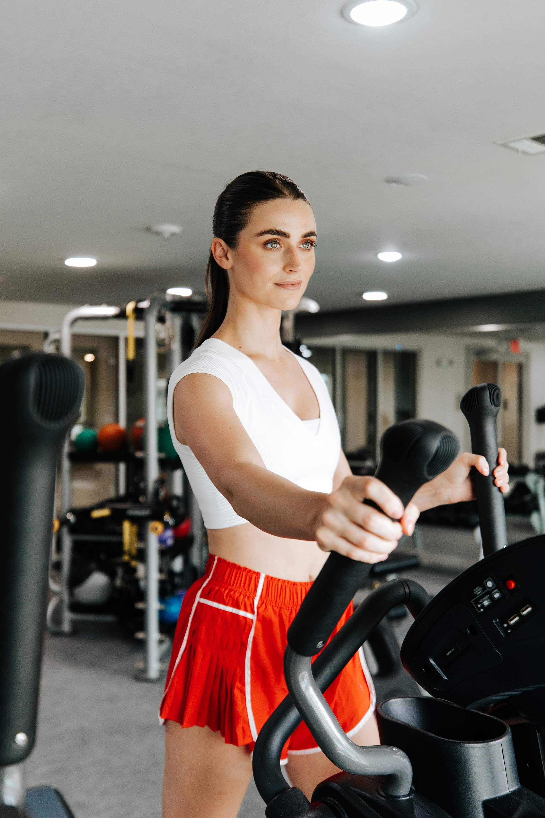 Villaggio woman exercises in fitness center