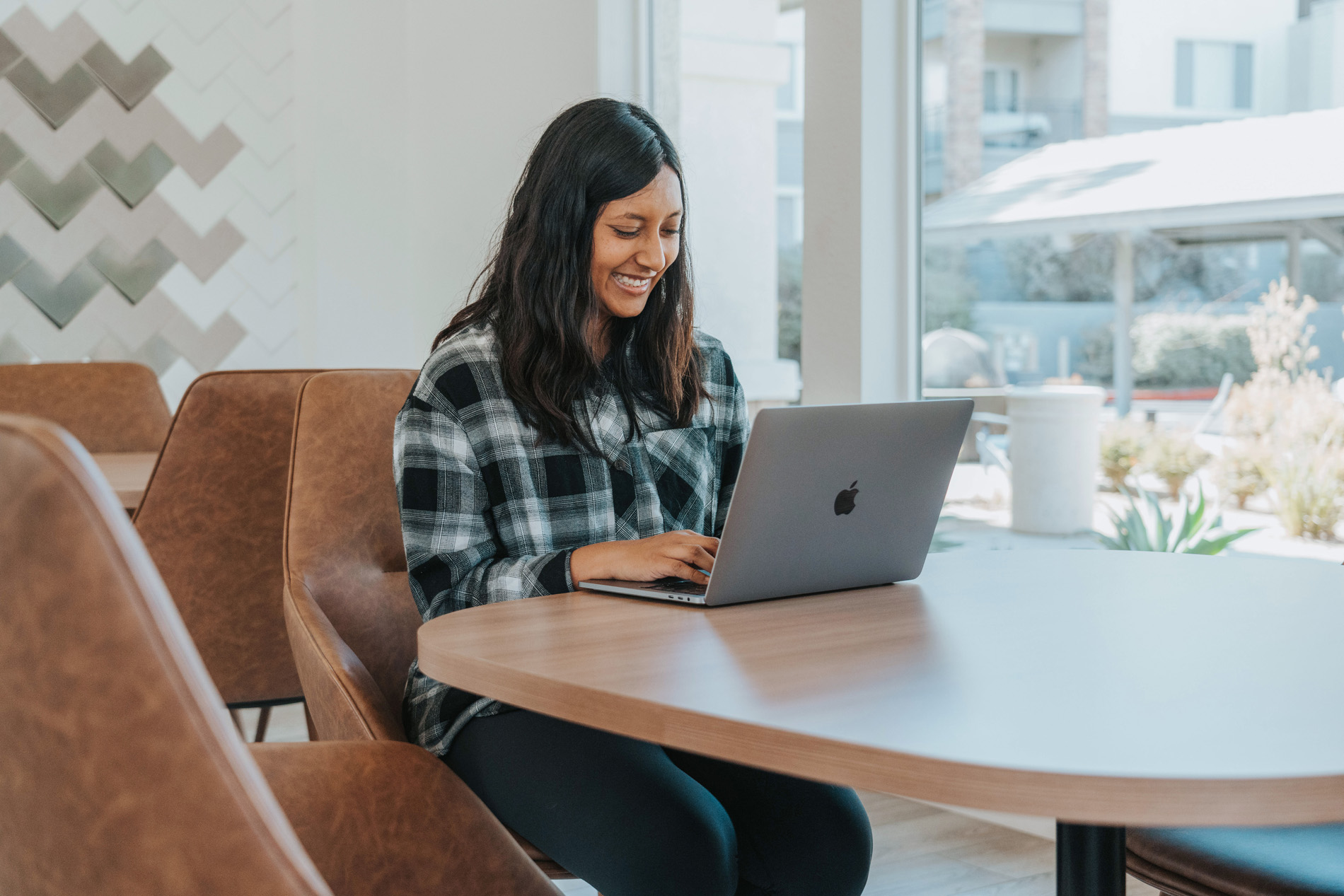 Windermere woman on laptop in clubhouse