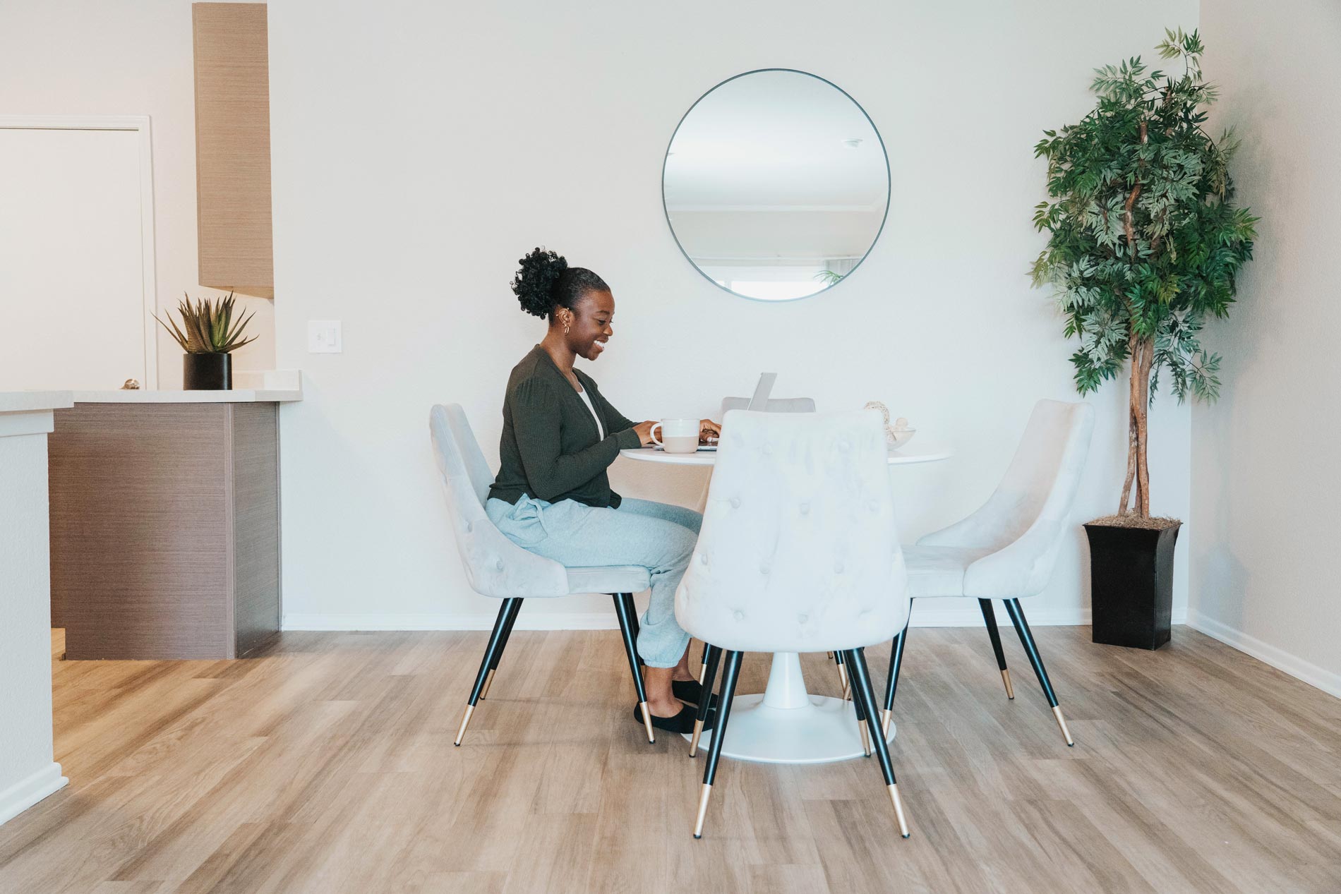 Windermere woman on laptop in dining room