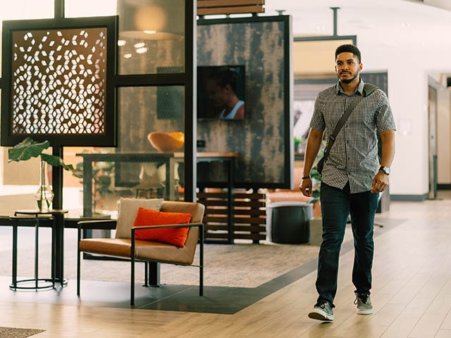 Man walking in Domus lobby