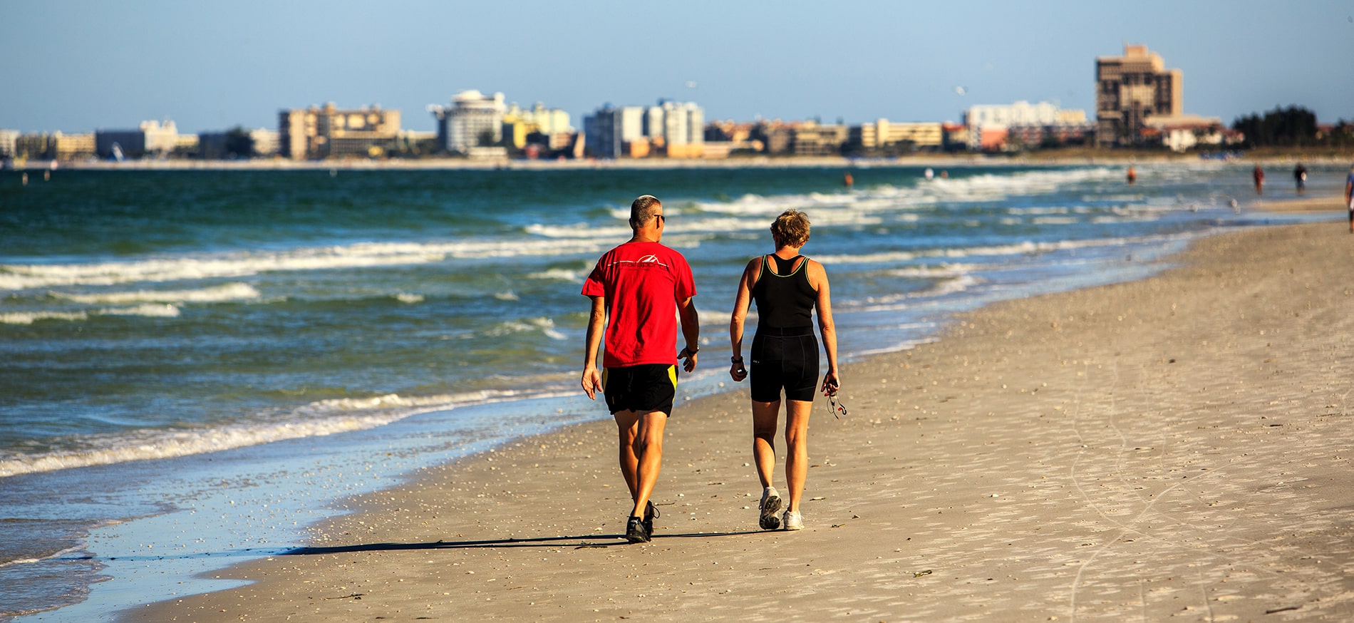 Couple walking along beach